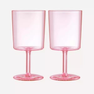 https://www.thehandbook.com/cdn-cgi/image/width=300,height=300,fit=pad,q=80,format=webp/https://files.thehandbook.com/uploads/2023/02/liberty-maison-balzac-pink-wine-glass-set-of-two.jpg